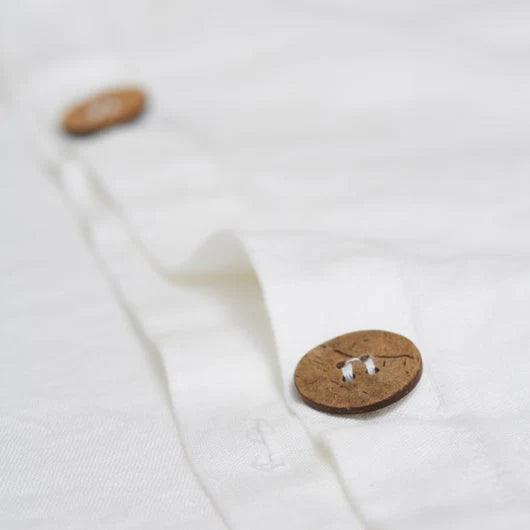 wooden buttons of the white duvet