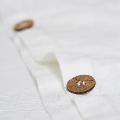 wooden buttons of the white duvet